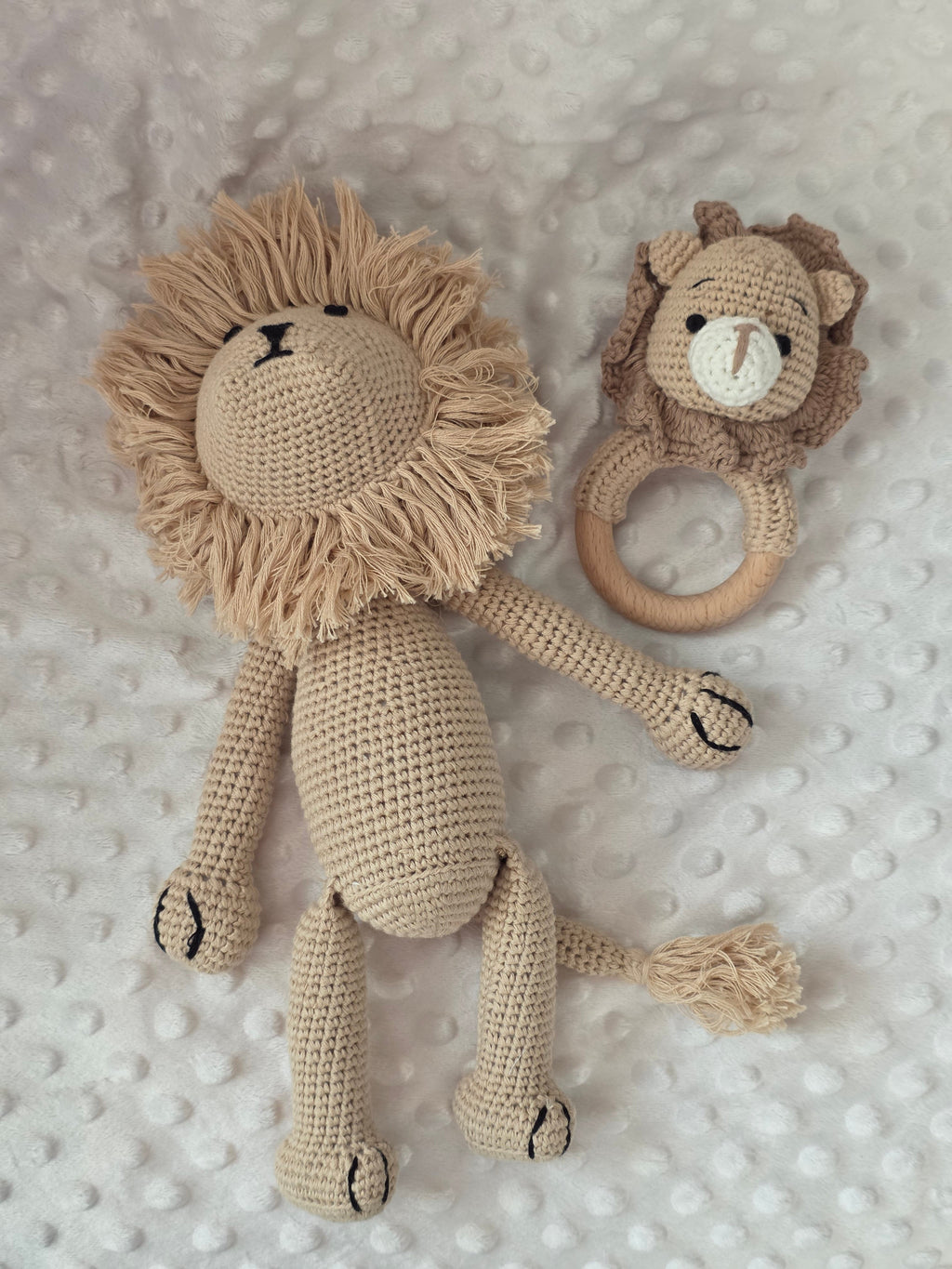 Handcrafted crochet lion soft toy and lion teething rattle included in the personalised baby gift hamper