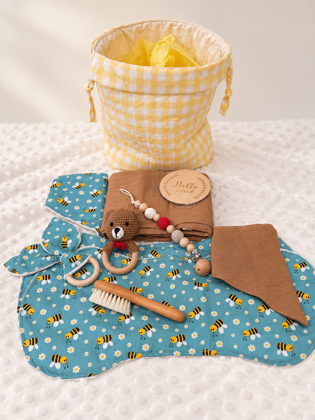 Lemon yellow Welcome Baby Hamper with bee print burp cloths, bibs, bear rattle and baby essentials